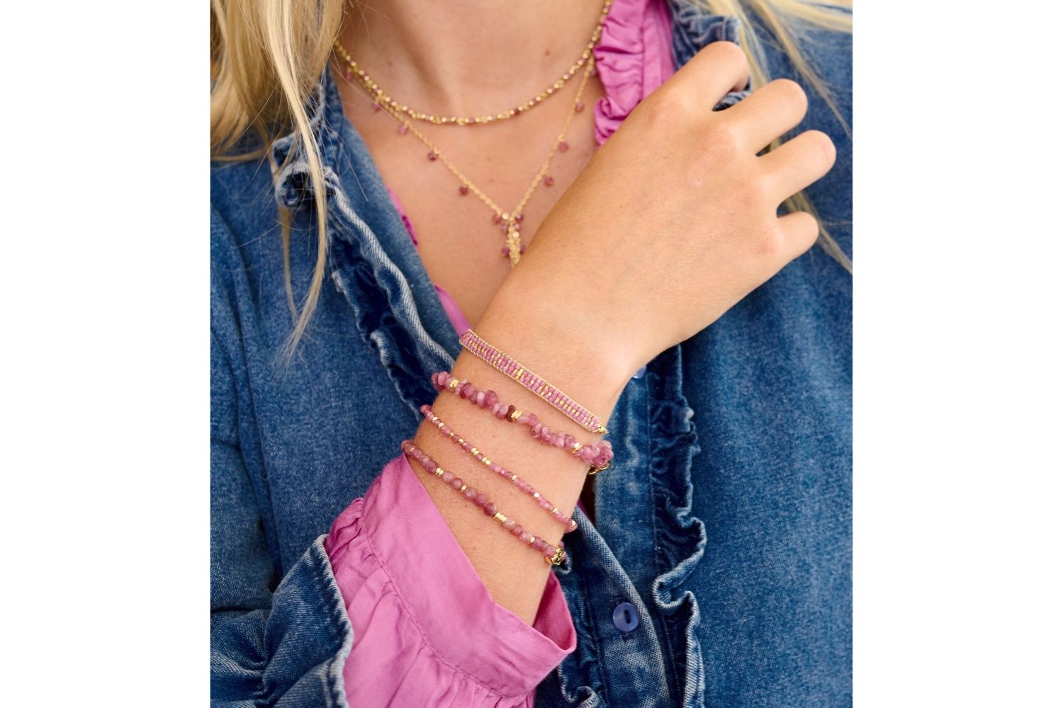 The perfect flash of pink with denim showcasing Dash, Harmony, Sana and Aslan bracelets. Finish the look with the Ivy and Panacea necklaces in Pink Tourmaline.