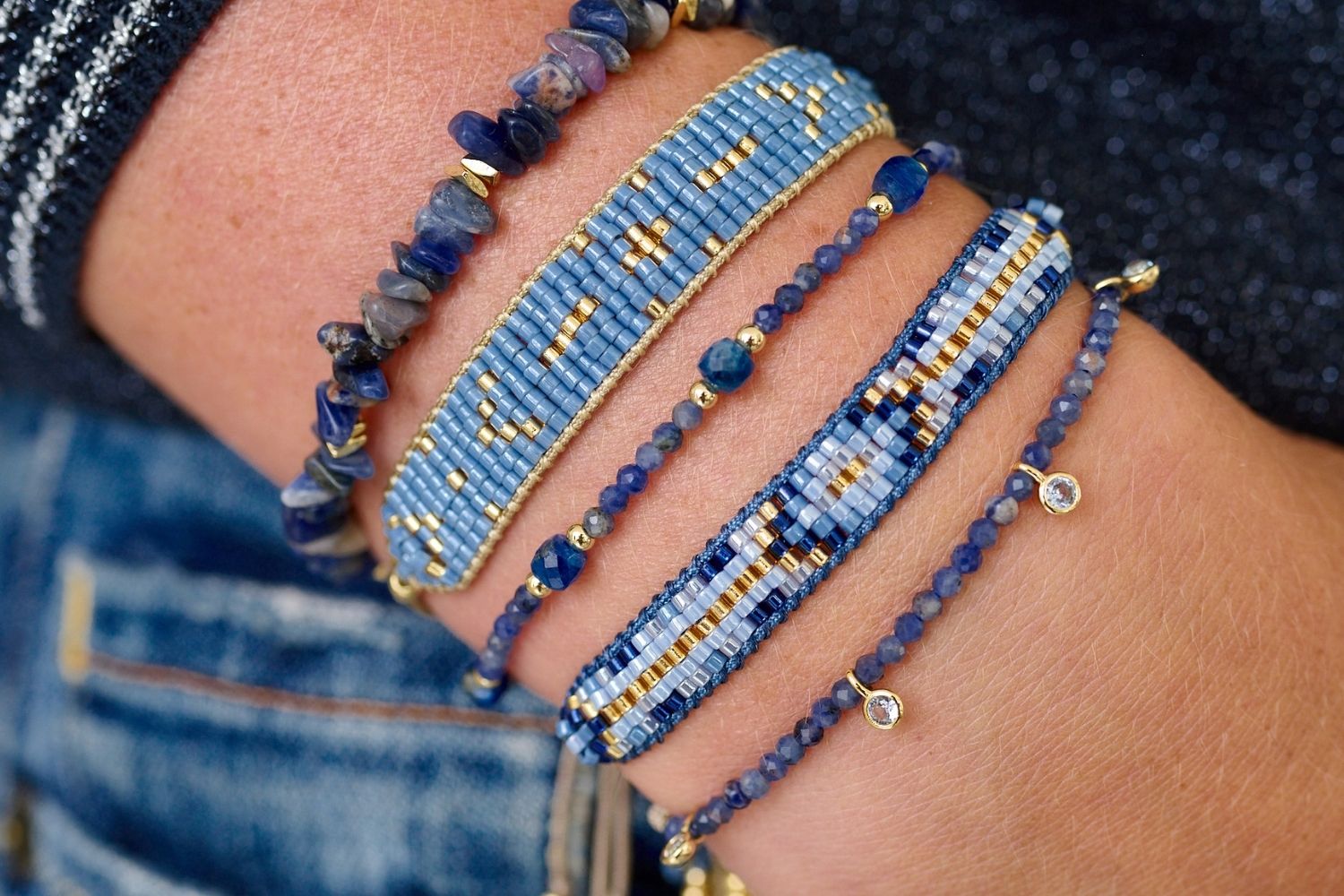 Denim Dreams come together with the Sana, Meadow and Holly Sodalite Bracelets paired with the beautifully hand beaded bracelets Fantasy and Grace in Blue. 