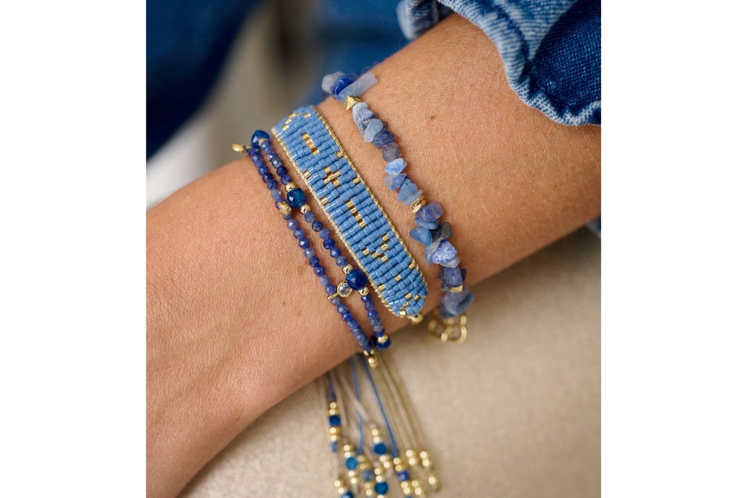 A beautiful Blue Aventurine crystal gold  stretch bracelet with rough-cut gemstones and a filigree Boho Betty gold charm. A meaningful and calming jewellery gift for her.