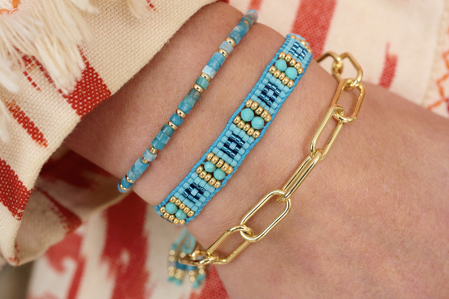 Gleaming gold with vibrant blues for this Summer ahead to brighten any outfit!