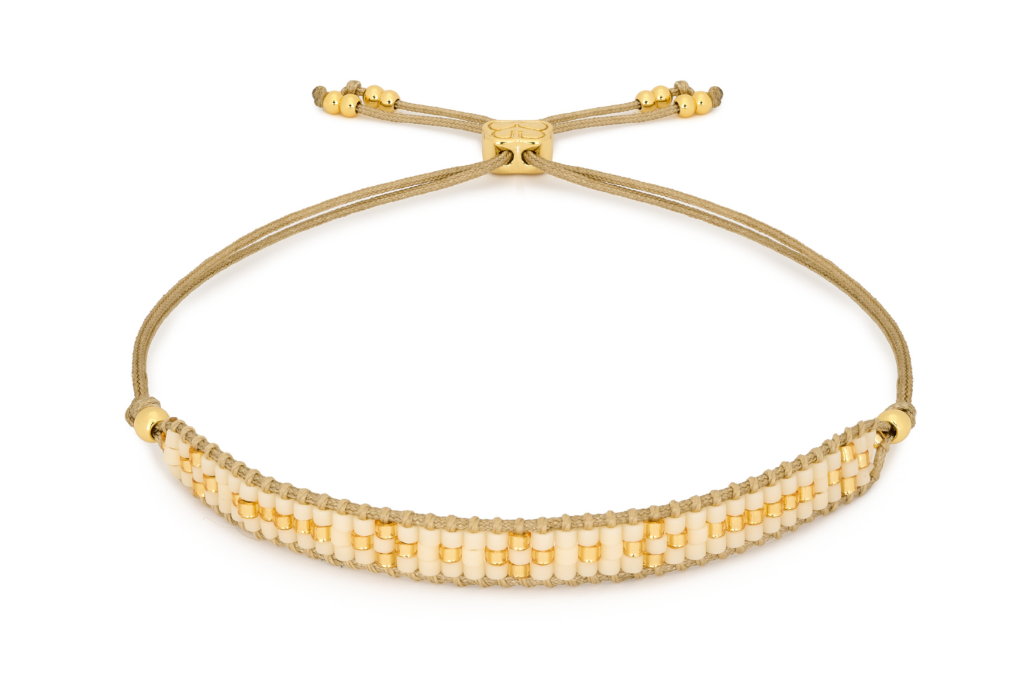 Aslan Gold & Cream Beaded Friendship Bracelet featuring soft cream Miyuki beads and 12k gold-plated accents, with an adjustable slider design for a comfortable fit.