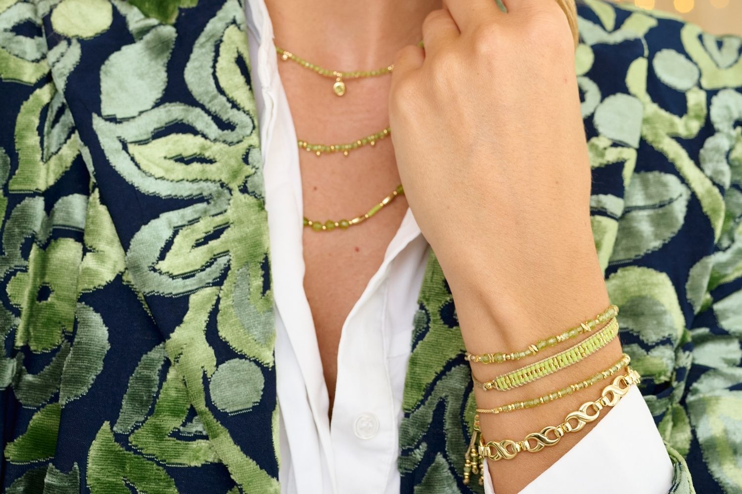 Aslan Gold & Lime Beaded Friendship Bracelet styled on the wrist, showcasing lime green beads and shimmering gold accents, perfect for tropical adventures and summer looks.