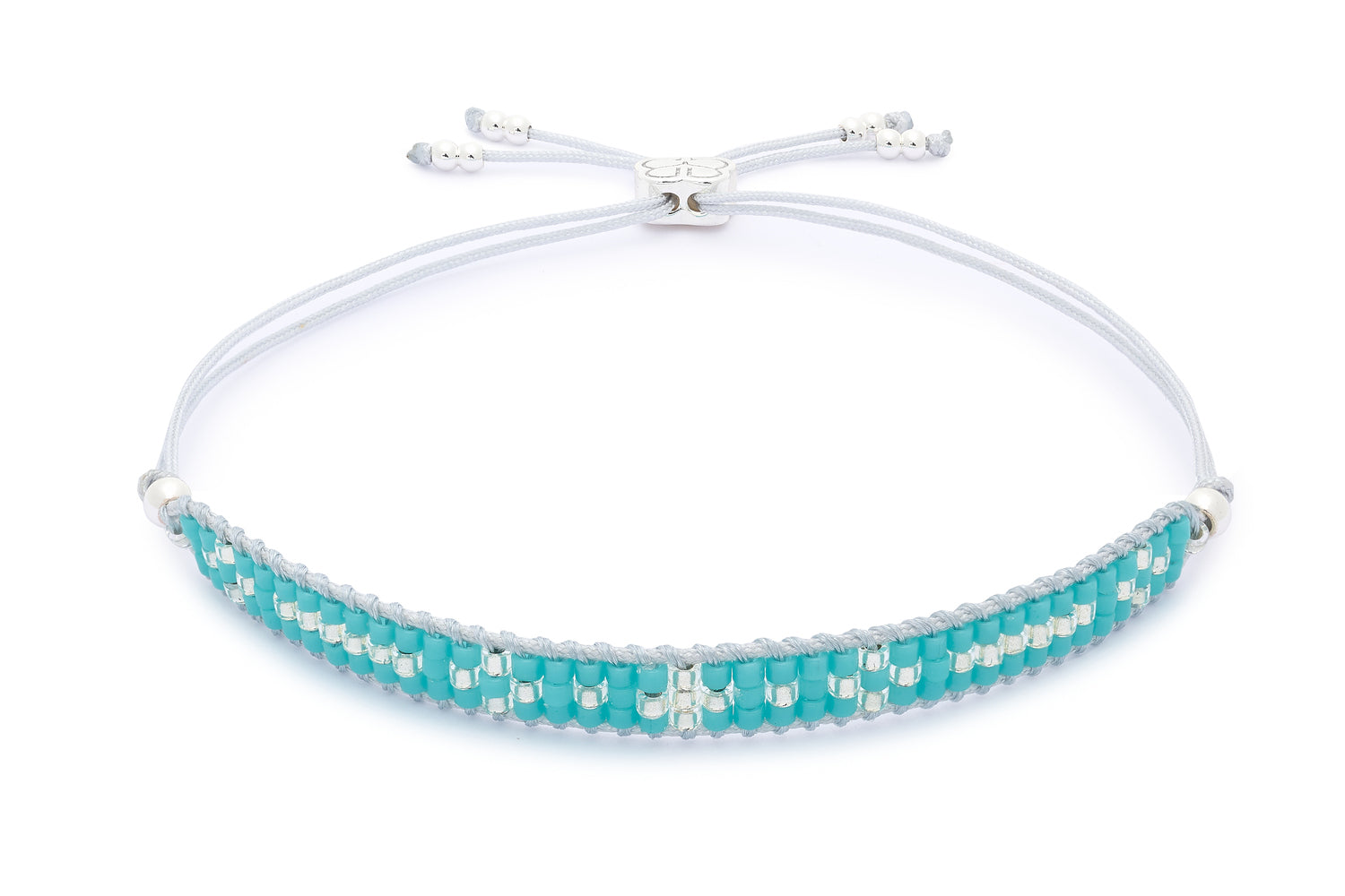 Aslan Silver & Turquoise Beaded Friendship Bracelet featuring vibrant turquoise Miyuki beads and sterling silver-plated accents, with an adjustable slider design for a comfortable fit.