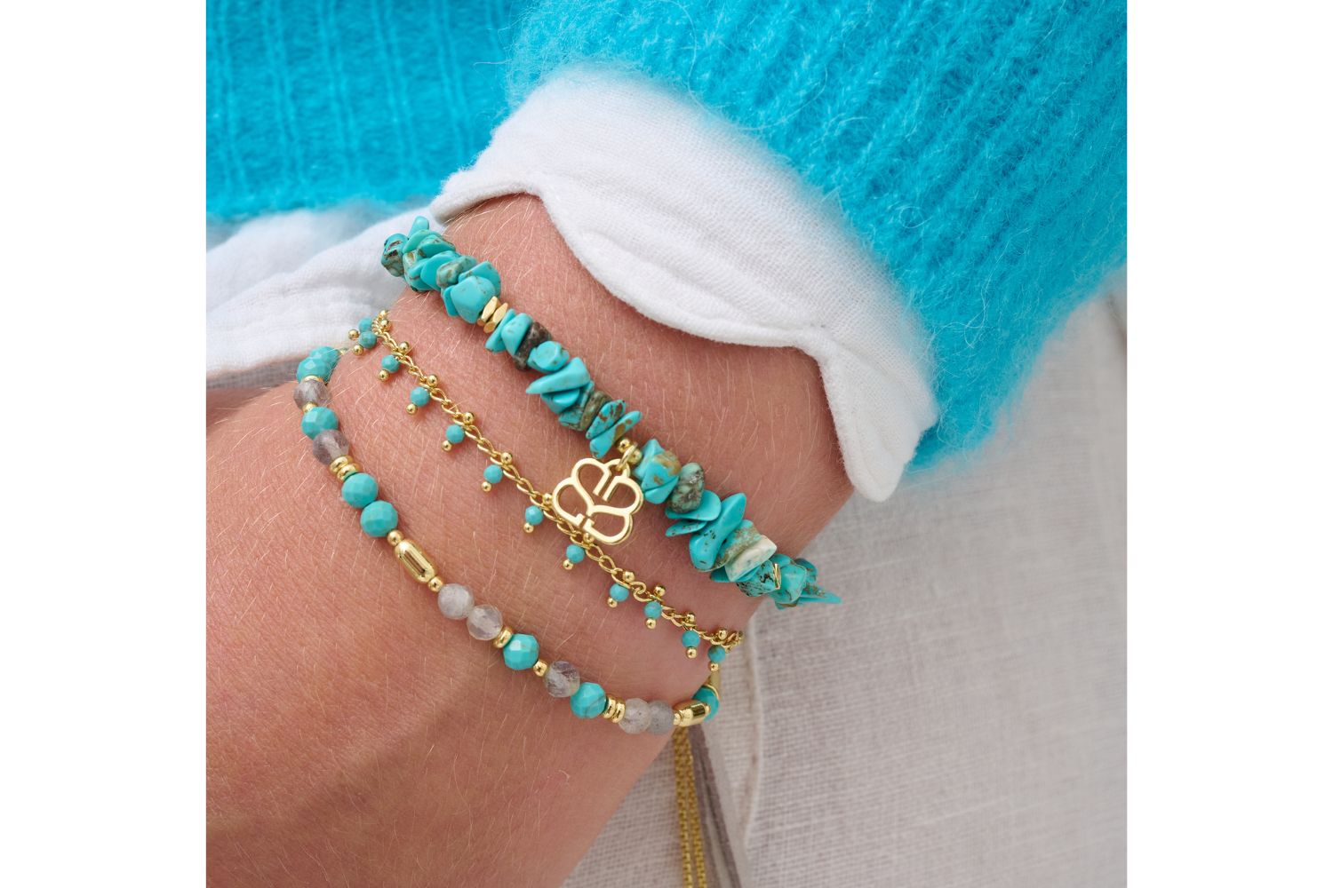 Turquoise bracelet stack featuring raw crystal gemstones, delicate beads, and hidden gold accents for a sun-kissed, boho look.