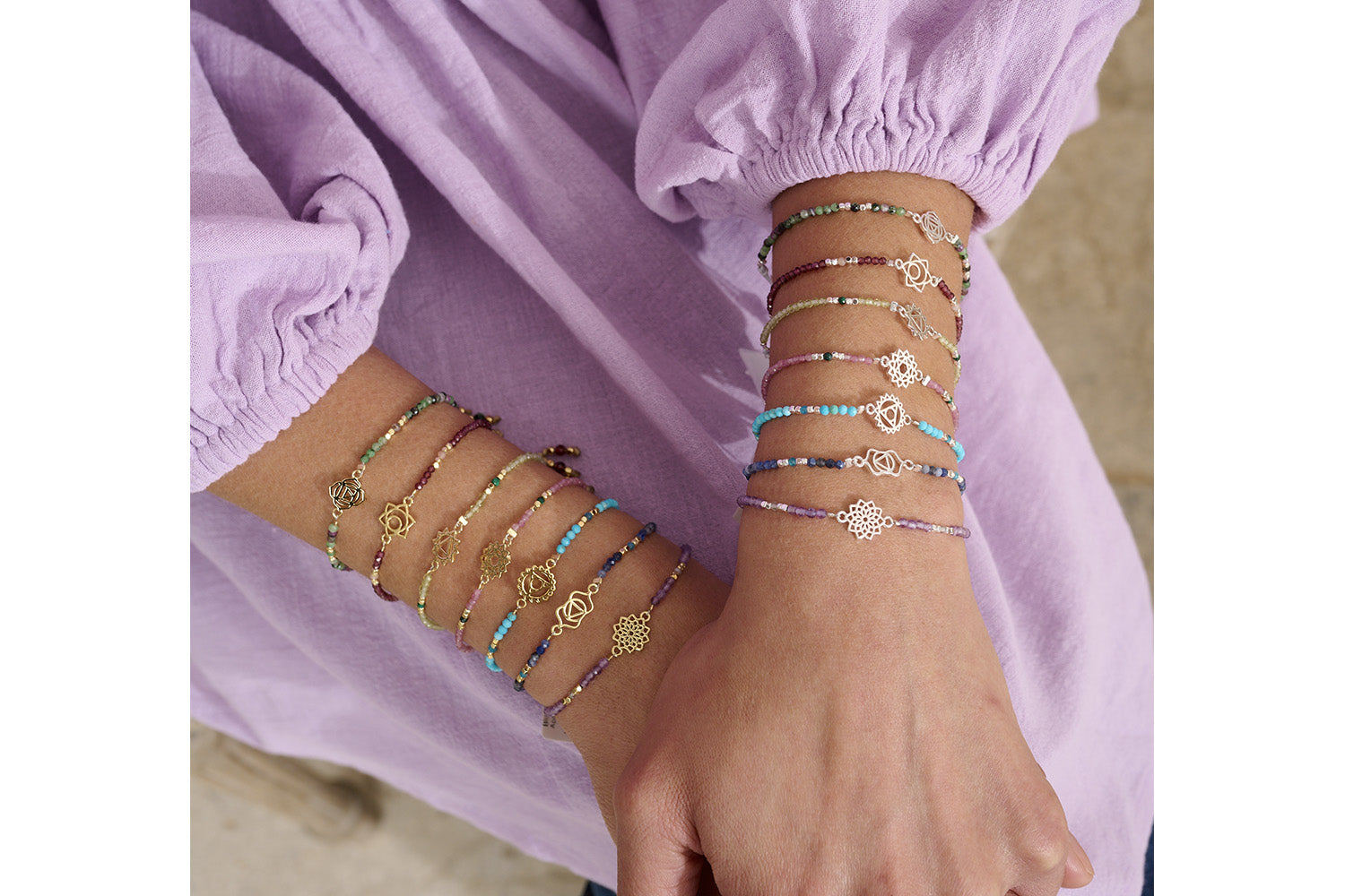 Crown Chakra Amethyst & Labradorite Silver Bracelet styled on the wrist, showcasing its ethereal gemstone hues, silver accents, and meaningful chakra charm.