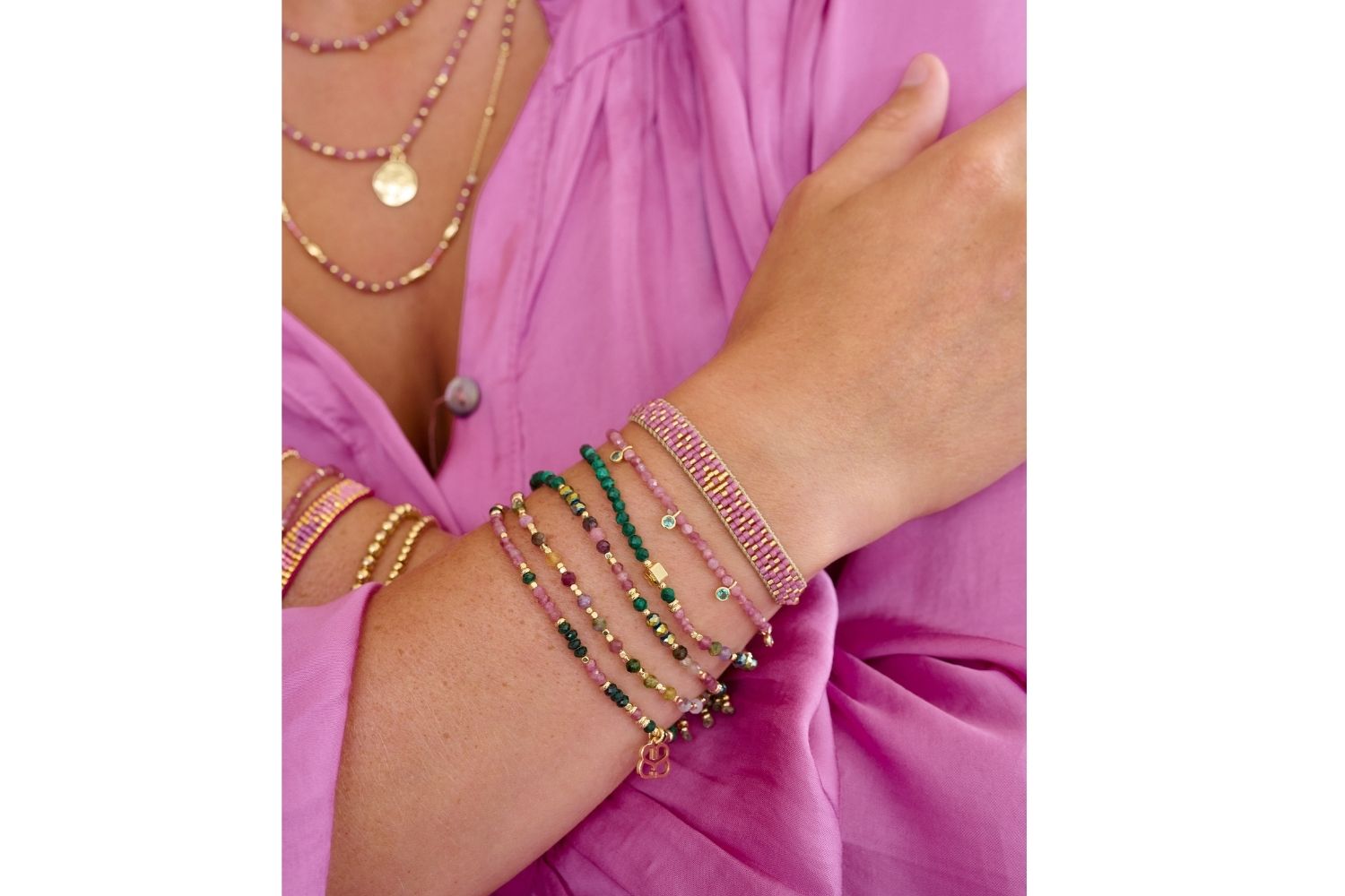 Dash Malachite & Pink Tourmaline Bracelet styled on the wrist, showcasing rich green malachite and pink tourmaline beads, ideal for layering or gifting as a birthstone bracelet.