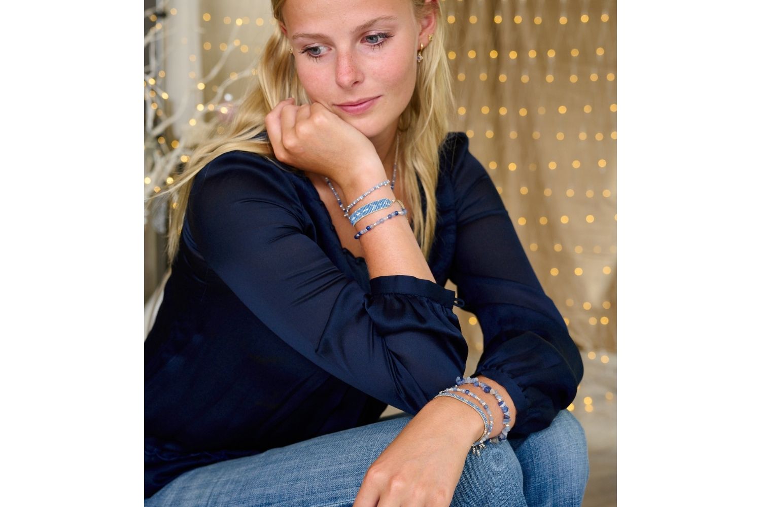 Grace Blue Silver Beaded Friendship Bracelet styled on the wrist, showcasing ice blue beads and shimmering silver accents, perfect for layering and adding a beachy, boho look.