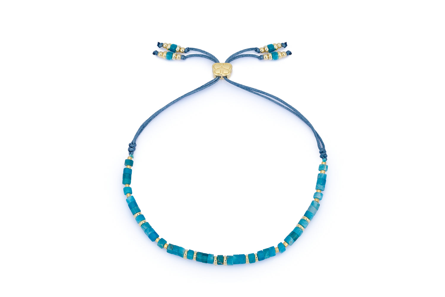 Liv Apatite & Gold Beaded Slider Bracelet featuring deep blue Apatite gemstones, 12k gold-plated beads, and an adjustable thread slider for a perfect fit.