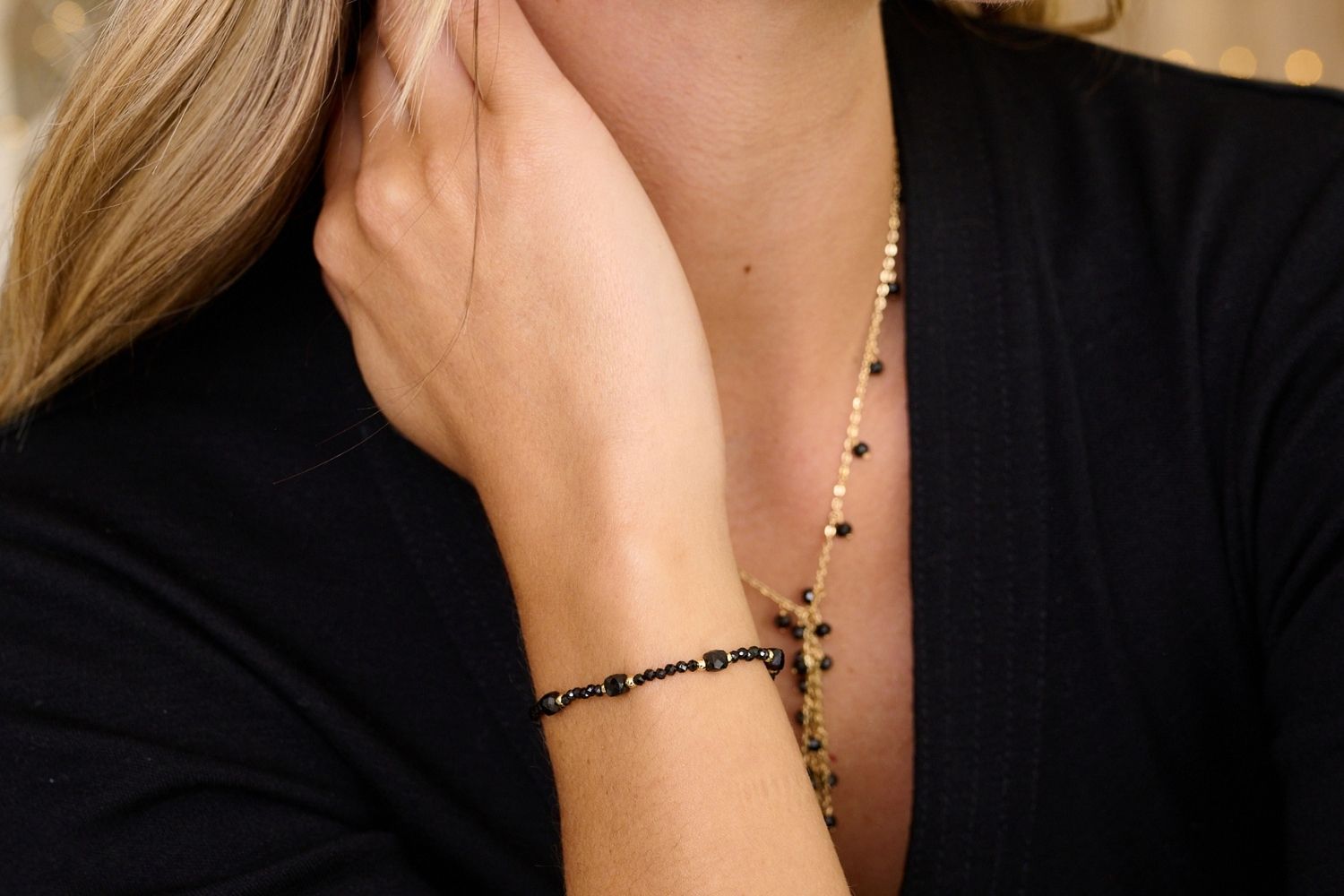 Meadow Gold & Black Spinel Gemstone Slider Bracelet styled on the wrist, featuring black Spinel beads and gold accents, perfect for  wearing solo or layering.