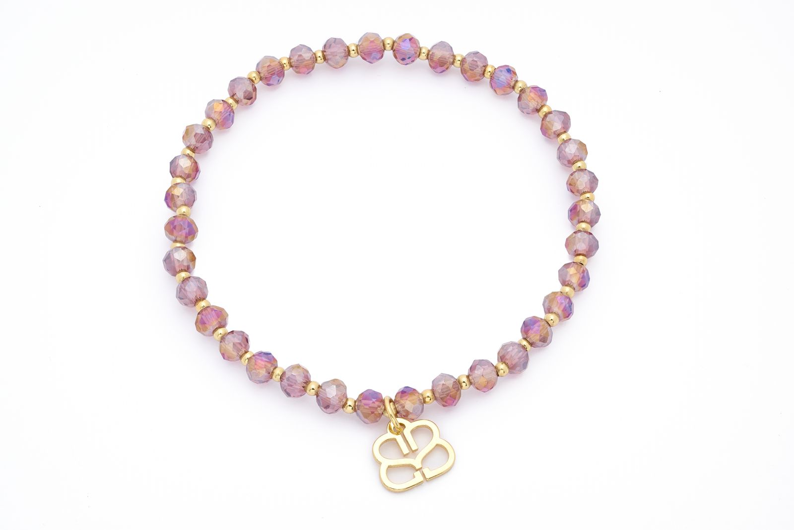 Prunus Crystal Bracelet featuring shimmering faceted pink rainbow beads and gold-plated accents with an elasticated fit.