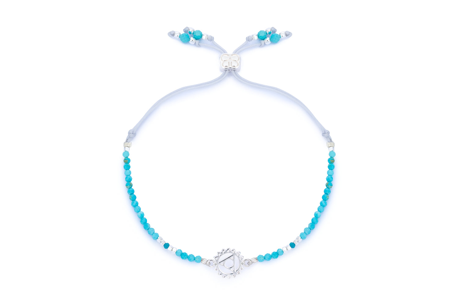 Turquoise Howlite, Apatite & Silver Throat Chakra Bracelet featuring calming blue gemstone beads, a sterling silver-plated chakra charm, and an adjustable slider fastening for a comfortable, custom fit.